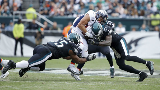 PHILADELPHIA, PA - NOVEMBER 05: Malcolm Jenkins #27 and Brandon Graham #55 of the Philadelphia Eagles make a tackle against the Denver Broncos during a game at Lincoln Financial Field on November 5, 2017 in Philadelphia, Pennsylvania. The Eagles defeated the Broncos 51-23.