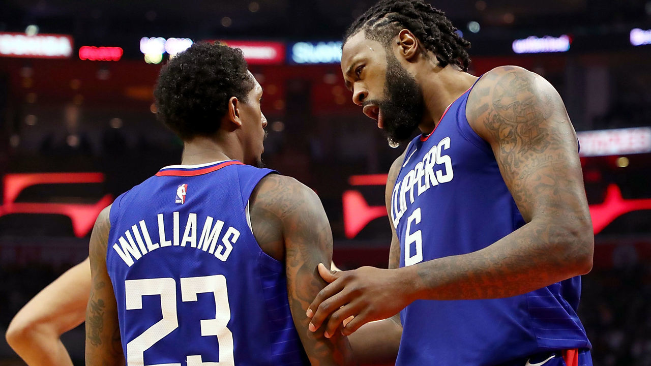 LOS ANGELES, CA - DECEMBER 31: Lou Williams #23 of the LA Clippers and DeAndre Jordan #6 of the LA Clippers chat between points in the fourth quarter at Staples Center on December 31, 2017 in Los Angeles, California.