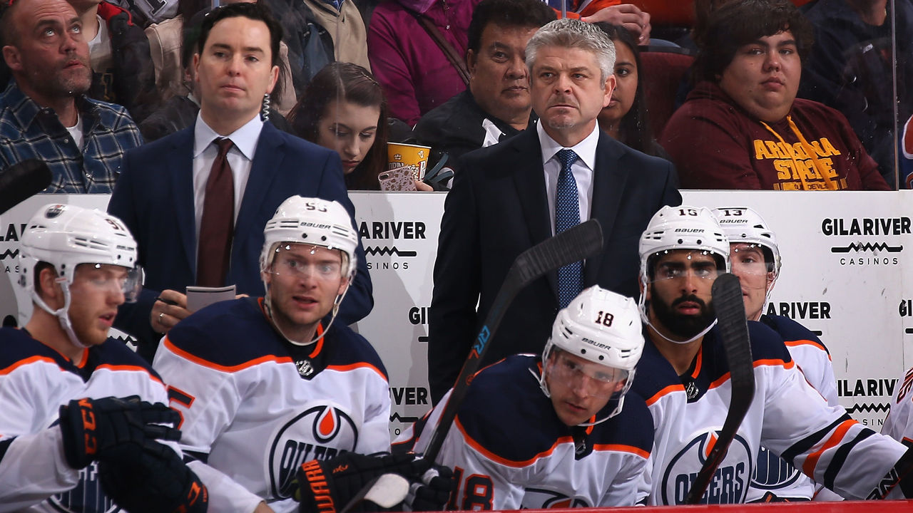 GLENDALE, AZ - JANUARY 12: Assistant coach Jay Woodcroft and head coach Todd McLellan of Edmonton Oilers watch from the bench during the third period of the NHL game against the Arizona Coyotes at Gila River Arena on January 12, 2018 in Glendale, Arizona. The Oilers defeated the Coyotes 4-2.