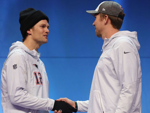 ST PAUL, MN - JANUARY 29: Tom Brady #12 of the New England Patriots and Nick Foles #9 of the Philadelphia Eagles shake hands during Super Bowl Media Day at Xcel Energy Center on January 29, 2018 in St Paul, Minnesota. Super Bowl LII will be played between the New England Patriots and the Philadelphia Eagles on February 4.