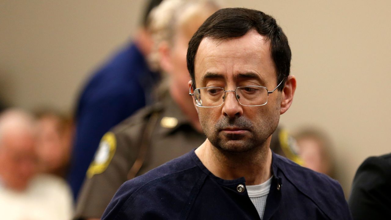 Former Michigan State University and USA Gymnastics doctor Larry Nassar addresses the court during the sentencing phase in Ingham County Circuit Court on January 24, 2018 in Lansing, Michigan. Disgraced former USA Gymnastics doctor Larry Nassar was sentenced to 40 to 175 years in prison on Wednesday for sexually abusing scores of young girls under the guise of medical treatment. 'I've just signed your death warrant,' Judge Rosemarie Aquilina said as she handed down the sentence after a week of gut-wrenching testimony by over 150 of Nassar's victims. / AFP PHOTO / JEFF KOWALSKY
