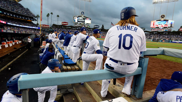 LOS ANGELES, CA - NOVEMBER 01: Justin Turner #10 of the Los Angeles Dodgers looks on from the dugout during the first inning against the Houston Astros in game seven of the 2017 World Series at Dodger Stadium on November 1, 2017 in Los Angeles, California.