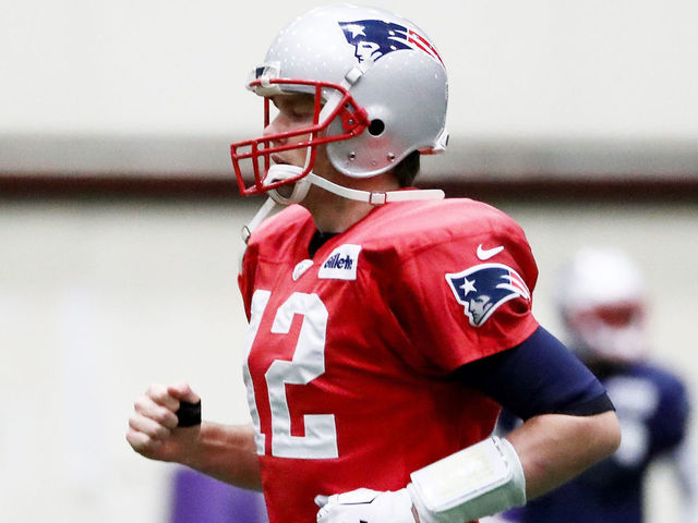 EDEN PRAIRIE, MN - JANUARY 31: Tom Brady #12 of the New England Patriots warms up during the New England Patriots practice on January 31, 2018 at Winter Park in Eden Prairie, Minnesota.The New England Patriots will play the Philadelphia Eagles in Super Bowl LII on February 4.