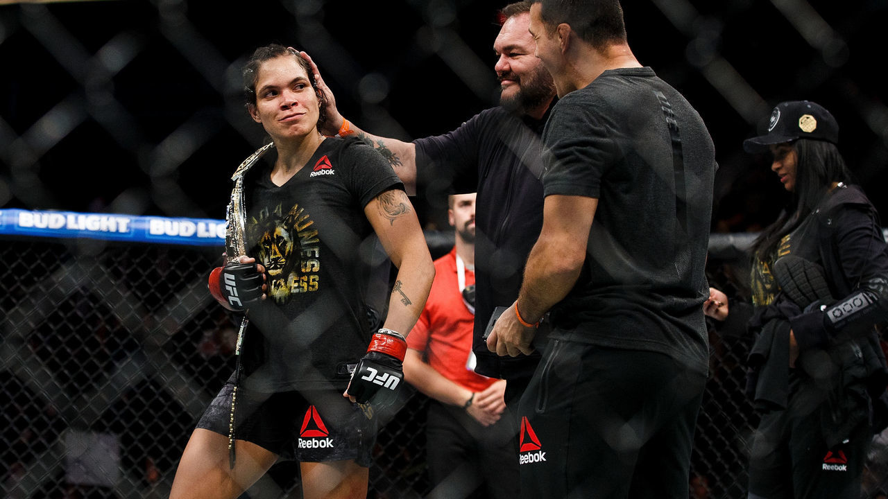 EDMONTON, AB - SEPTEMBER 09: Amanda Nunes celebrates her victory against Valentina Shevchenko during UFC 215 at Rogers Place on September 9, 2017 in Edmonton, Canada.