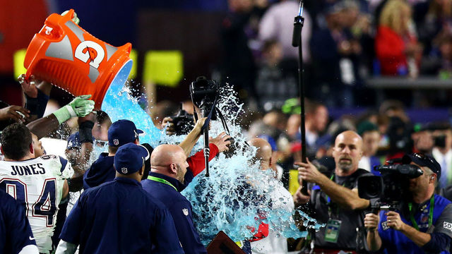 GLENDALE, AZ - FEBRUARY 01: Head coach Bill Belichick of the New England Patriots is dunked by with Gatorade in the fourth quarter during Super Bowl XLIX at University of Phoenix Stadium on February 1, 2015 in Glendale, Arizona.