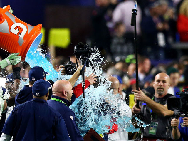 GLENDALE, AZ - FEBRUARY 01: Head coach Bill Belichick of the New England Patriots is dunked by with Gatorade in the fourth quarter during Super Bowl XLIX at University of Phoenix Stadium on February 1, 2015 in Glendale, Arizona.