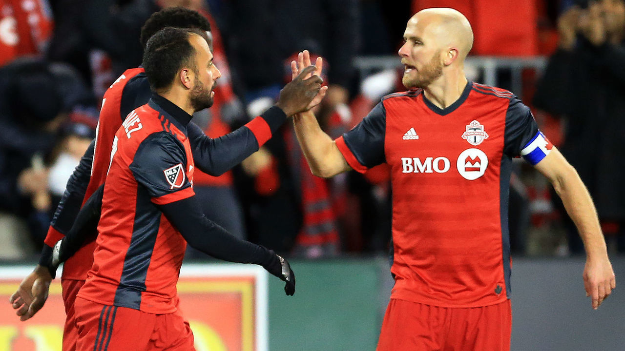 TORONTO, ON - NOVEMBER 29: Michael Bradley #4 of Toronto FC congratulates Jozy Altidore #17 after his goal during the second half of the MLS Eastern Conference Finals, Leg 2 game against Columbus Crew SC at BMO Field on November 29, 2017 in Toronto, Ontario, Canada.