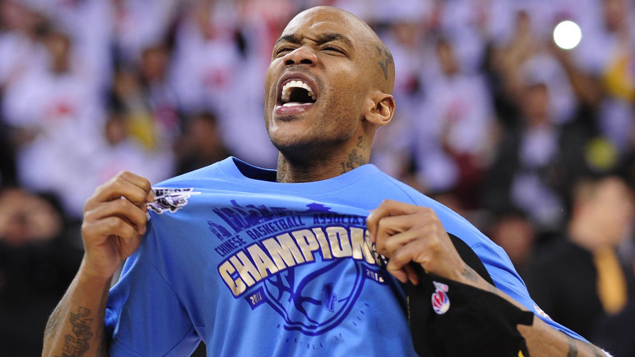 Former NBA superstar Stephon Marbury celebrates after his team, the Beijing Ducks, won their first-ever Chinese championship in Beijing on March 30, 2012. Led by former NBA badboy Marbury, who scored 41 points as the host team knocked off title holders Guangdong Tigers 124-121. AFP PHOTO