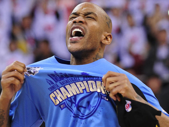 Former NBA superstar Stephon Marbury celebrates after his team, the Beijing Ducks, won their first-ever Chinese championship in Beijing on March 30, 2012. Led by former NBA badboy Marbury, who scored 41 points as the host team knocked off title holders Guangdong Tigers 124-121. AFP PHOTO