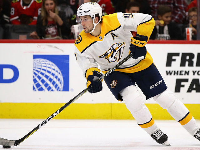 CHICAGO, IL - OCTOBER 14: Filip Forsberg #9 of the Nashville Predators controls the puck against the Chicago Blackhawks at the United Center on October 14, 2017 in Chicago, Illinois. The Blackhawks defeated the Predators 2-1 in overtime.