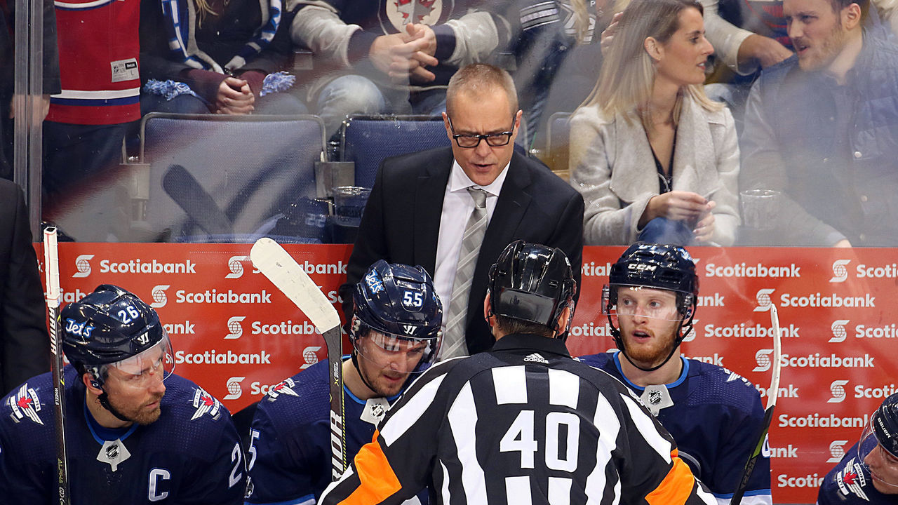 WINNIPEG, MB - DECEMBER 1: Head Coach Paul Maurice of the Winnipeg Jets listens to an explanation given by referee Steve Kozari #40 during a third period stoppage in play against the Vegas Golden Knights at the Bell MTS Place on December 1, 2017 in Winnipeg, Manitoba, Canada.