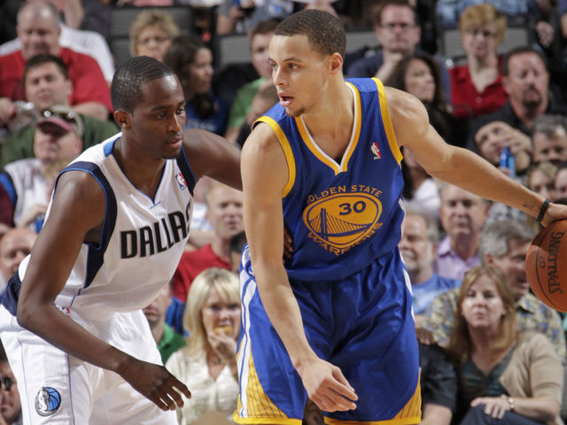 DALLAS, TX - MARCH 20: Stephen Curry #30 of the Golden State Warriors backs down Rodrigue Beaubois #3 of the Dallas Mavericks during a game on March 20, 2011 at the American Airlines Center in Dallas, Texas. Mandatory Copyright Notice: Copyright 2011 NBAE
