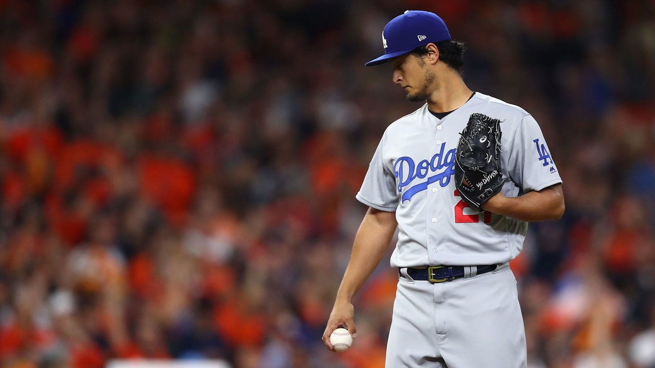 HOUSTON, TX - OCTOBER 27: Yu Darvish #21 of the Los Angeles Dodgers looks on after giving up a solo home run to Yuli Gurriel #10 of the Houston Astros during the second inning in game three of the 2017 World Series at Minute Maid Park on October 27, 2017 in Houston, Texas.