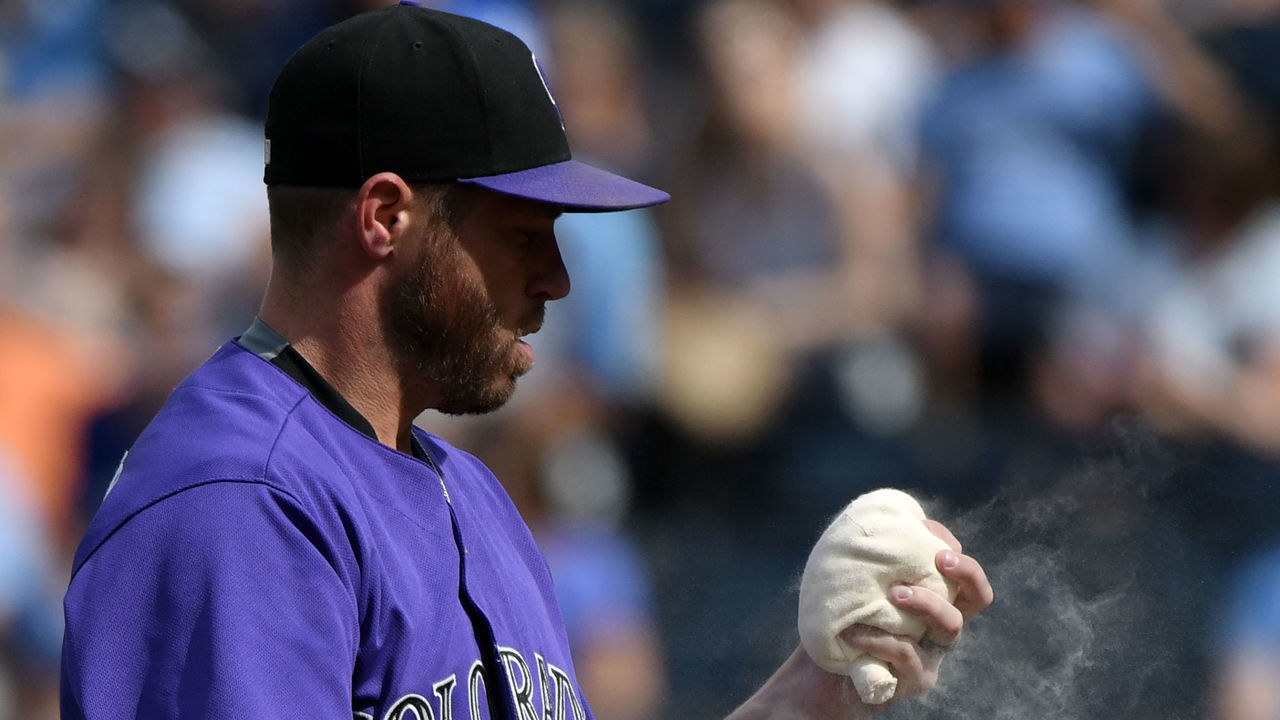 KANSAS CITY, MO - AUGUST 24: Greg Holland #56 of the Colorado Rockies uses the rosin bag before throwing against the Kansas City Royals in the ninth inning at Kauffman Stadium on August 24, 2017 in Kansas City, Missouri.