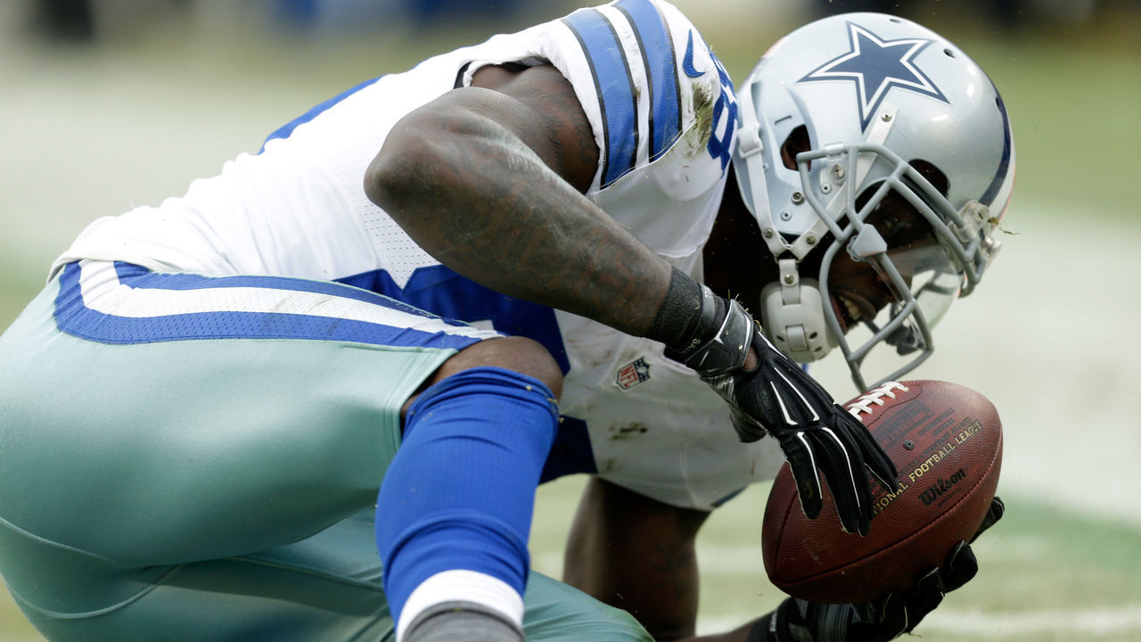 GREEN BAY, WI - JANUARY 11: Dez Bryant #88 of the Dallas Cowboys attempts a catch over Sam Shields #37 of the Green Bay Packers during the 2015 NFC Divisional Playoff game at Lambeau Field on January 11, 2015 in Green Bay, Wisconsin. Initially ruled a catch, the call was reversed upon review.