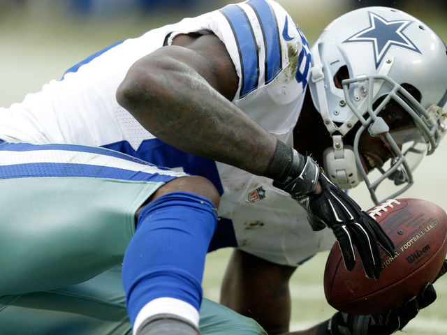 GREEN BAY, WI - JANUARY 11: Dez Bryant #88 of the Dallas Cowboys attempts a catch over Sam Shields #37 of the Green Bay Packers during the 2015 NFC Divisional Playoff game at Lambeau Field on January 11, 2015 in Green Bay, Wisconsin. Initially ruled a catch, the call was reversed upon review.