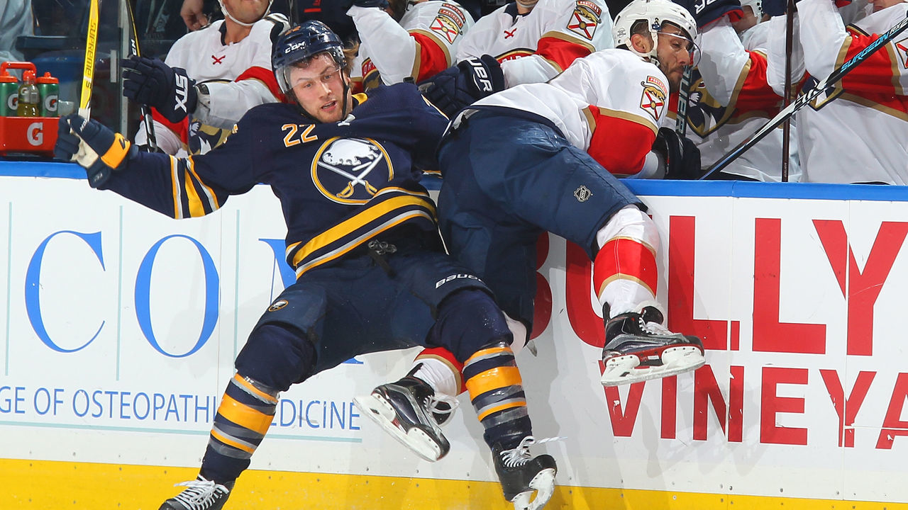 BUFFALO, NY - FEBRUARY 1: Johan Larsson #22 of the Buffalo Sabres checks Vincent Trocheck #21 of the Florida Panthers during an NHL game on February 1, 2018 at KeyBank Center in Buffalo, New York.
