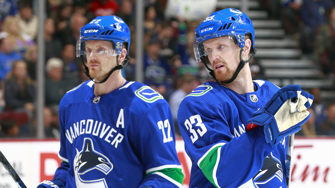 VANCOUVER, BC - JANUARY 2: Henrik Sedin #33 and Daniel Sedin #22 of the Vancouver Canucks skate up ice during their NHL game against the Anaheim Ducks at Rogers Arena January 2, 2018 in Vancouver, British Columbia, Canada. 'n