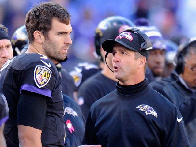 BALTIMORE, MD - OCTOBER 19: Head coach John Harbaugh of the Baltimore Ravens speaks with quarterback Joe Flacco #5 of the Baltimore Ravens on the sideline during the second half of a game against the Atlanta Falcons at M&T Bank Stadium on October 19, 2014 in Baltimore, Maryland.