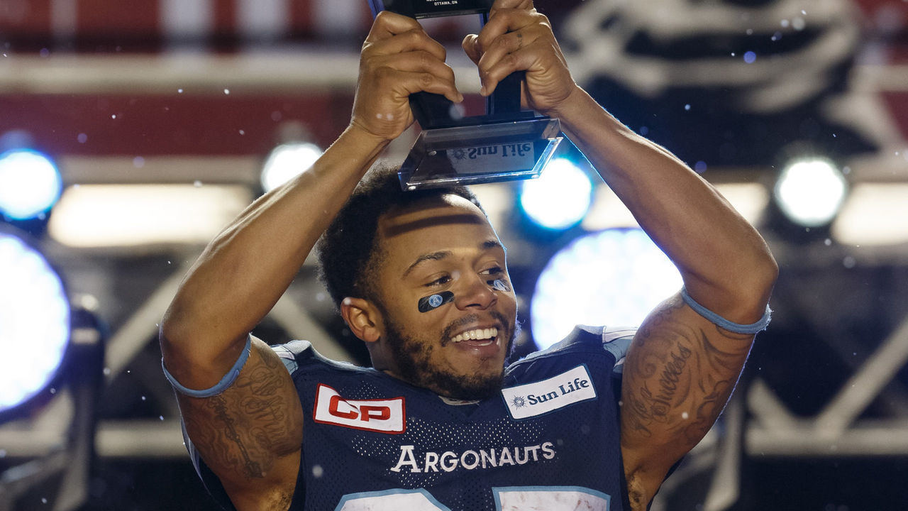 OTTAWA, ON - NOVEMBER 26: DeVier Posey #85 of the Toronto Argonauts is awarded with the Most Valuable Player trophy after a win against the Calgary Stampeders in the 105th Grey Cup Championship Game at TD Place Stadium on November 26, 2017 in Ottawa, Canada.