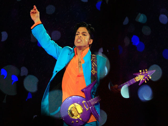 MIAMI GARDENS, FL - FEBRUARY 04: Prince performs in the rain during the 'Pepsi Halftime Show' at Super Bowl XLI between the Indianapolis Colts and the Chicago Bears on February 4, 2007 at Dolphin Stadium in Miami Gardens, Florida.