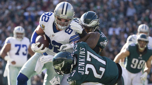 PHILADELPHIA, PA - JANUARY 1: Jason Witten #82 of the Dallas Cowboys catches a pass and is tackled by Jordan Hicks #58 and Malcolm Jenkins #27 of the Philadelphia Eagles in the first quarter at Lincoln Financial Field on January 1, 2017 in Philadelphia, Pennsylvania.