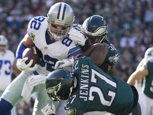 PHILADELPHIA, PA - JANUARY 1: Jason Witten #82 of the Dallas Cowboys catches a pass and is tackled by Jordan Hicks #58 and Malcolm Jenkins #27 of the Philadelphia Eagles in the first quarter at Lincoln Financial Field on January 1, 2017 in Philadelphia, Pennsylvania.