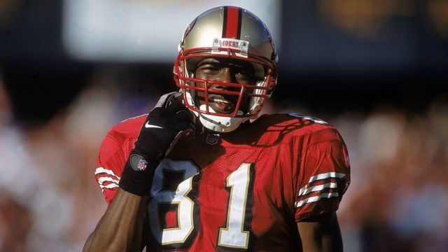 29 Oct 2000: Terrell Owens #81 of the San Francisco 49ers clips his chin strap during a game against the St. Louis Rams at 3Com Park in San Francisco, California. The Rams defeated the 49ers 34-24.Mandatory Credit: Harry How /Allsport