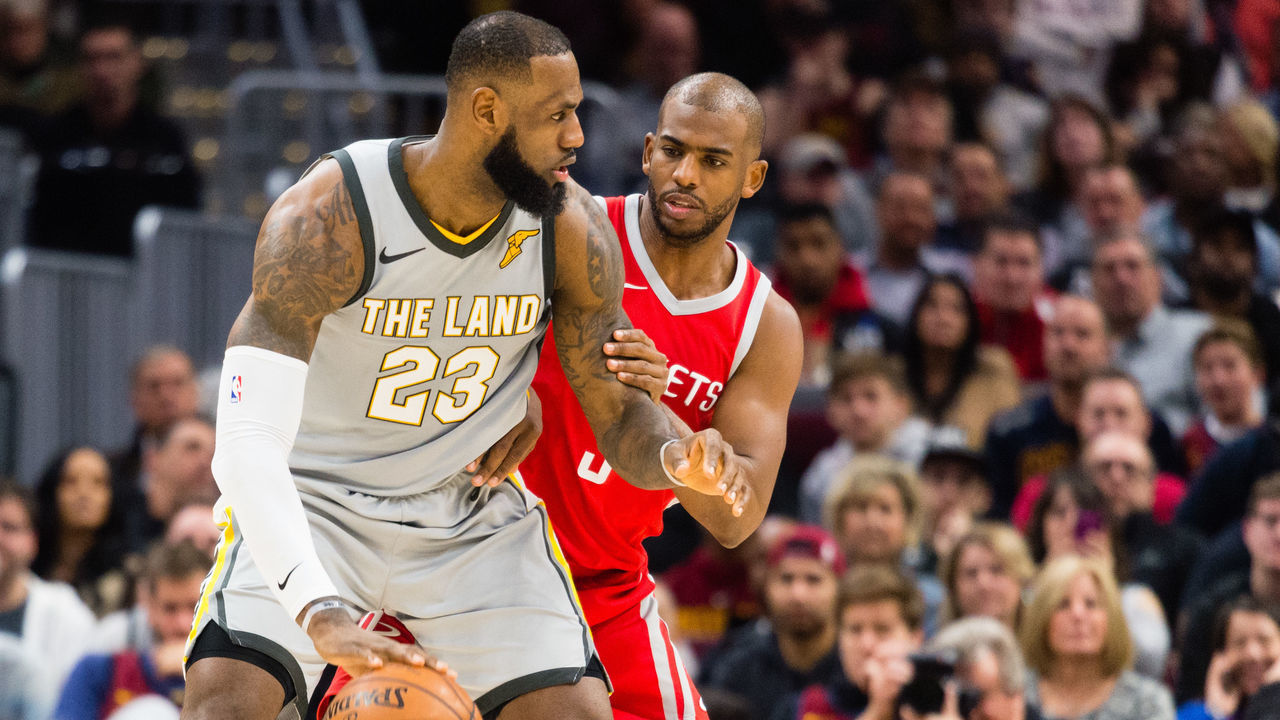 CLEVELAND, OH - FEBRUARY 3: LeBron James #23 of the Cleveland Cavaliers tries to drive around Chris Paul #3 of the Houston Rockets during the first half at Quicken Loans Arena on February 3, 2018 in Cleveland, Ohio.