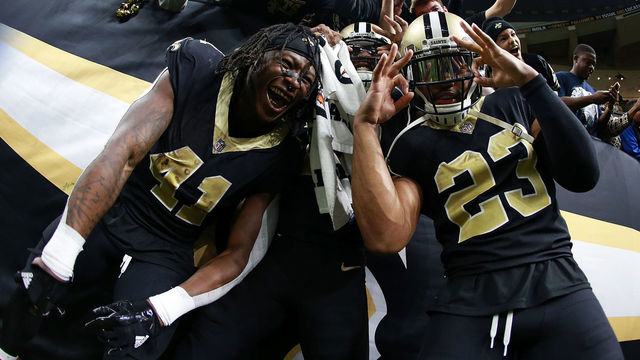 NEW ORLEANS, LA - DECEMBER 24: Alvin Kamara #41 of the New Orleans Saints, Marshon Lattimore #23 and Michael Thomas #13 celebrate after a game against the Atlanta Falcons at the Mercedes-Benz Superdome on December 24, 2017 in New Orleans, Louisiana.