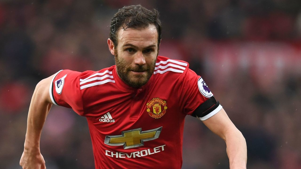 Manchester United's Spanish midfielder Juan Mata runs with the ball during the English Premier League football match between Manchester United and Huddersfield Town at Old Trafford in Manchester, north west England, on February 3, 2018. / AFP PHOTO / Paul ELLIS /
