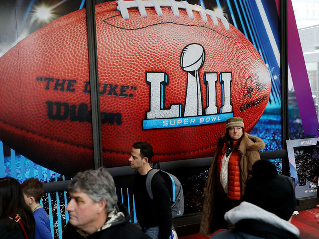 MINNEAPOLIS, MN - FEBRUARY 03: Fans make their way through Nicollet Mall during the Super Bowl Live event on February 3, 2018 in Minneapolis, Minnesota. Super Bowl LII will be played at US Bank Stadium on February 4th between the New England Patriots and the Philadelphia Eagles.