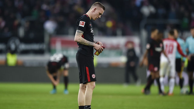 Frankfurt's German forward Marius Wolf reacts at the end of the German first division Bundesliga football match 1 FC Augsburg vs Eintracht Frankfurt in Augsburg, southern Germany, on February 4, 2018. / AFP PHOTO / Guenter SCHIFFMANN / RESTRICTIONS: DURING MATCH TIME: DFL RULES TO LIMIT THE ONLINE USAGE TO 15 PICTURES PER MATCH AND FORBID IMAGE SEQUENCES TO SIMULATE VIDEO. == RESTRICTED TO EDITORIAL USE == FOR FURTHER QUERIES PLEASE CONTACT DFL DIRECTLY AT + 49 69 650050