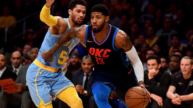 LOS ANGELES, CA - JANUARY 03: Paul George #13 of the Oklahoma City Thunder drives past Josh Hart #5 of the Los Angeles Lakers during the first half at Staples Center on January 3, 2018 in Los Angeles, California.