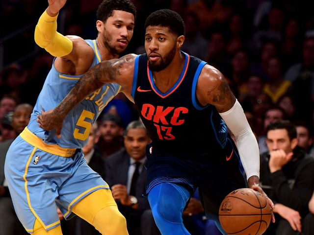 LOS ANGELES, CA - JANUARY 03: Paul George #13 of the Oklahoma City Thunder drives past Josh Hart #5 of the Los Angeles Lakers during the first half at Staples Center on January 3, 2018 in Los Angeles, California.