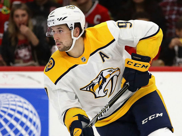 CHICAGO, IL - OCTOBER 14: Filip Forsberg #9 of the Nashville Predators controls the puck against the Chicago Blackhawks at the United Center on October 14, 2017 in Chicago, Illinois. The Blackhawks defeated the Predators 2-1 in overtime.
