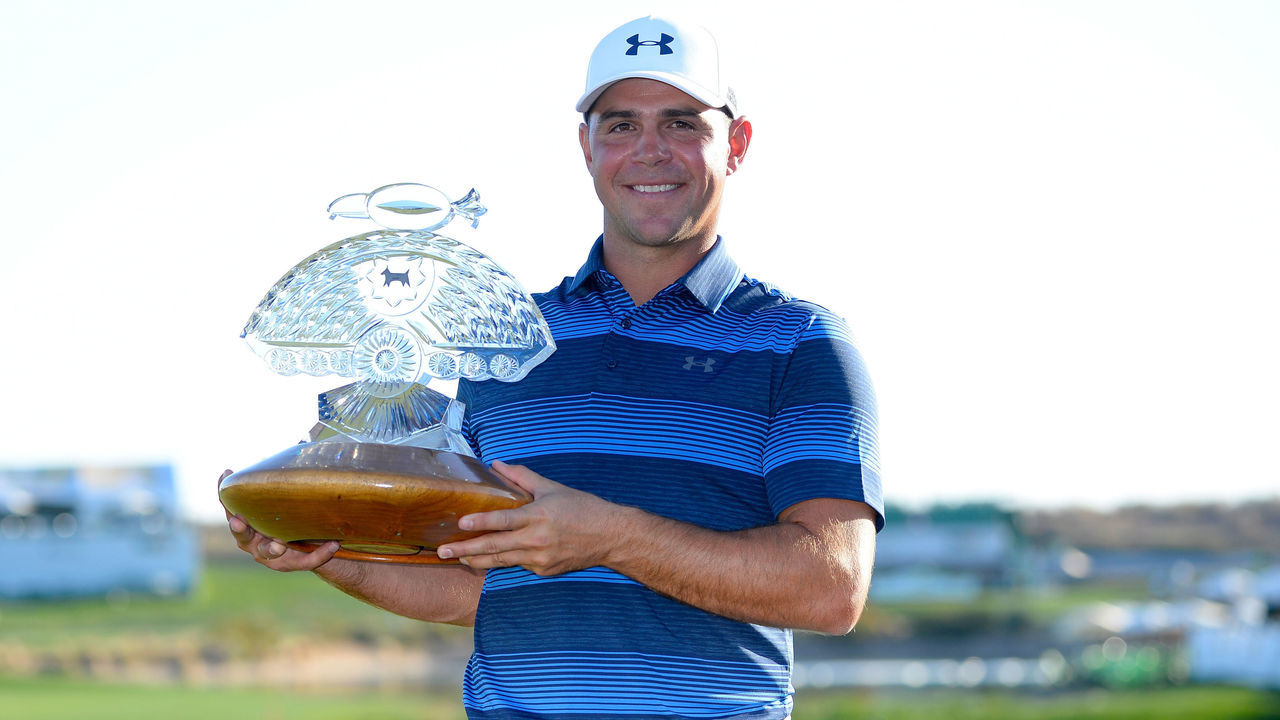 SCOTTSDALE, AZ - FEBRUARY 04: Gary Woodland poses with the trophy after winning the Waste Management Phoenix Open at TPC Scottsdale on February 4, 2018 in Scottsdale, Arizona.