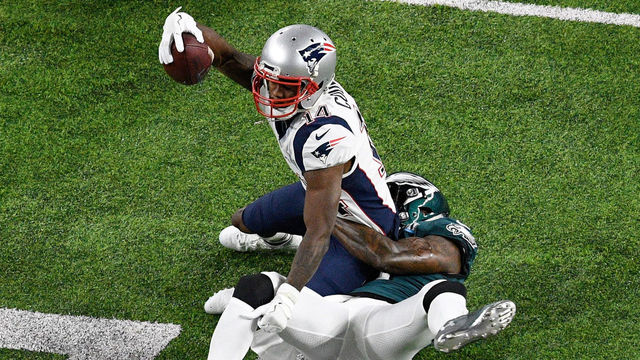 MINNEAPOLIS, MN - FEBRUARY 04: Malcolm Jenkins #27 of the Philadelphia Eagles tackles Brandin Cooks #14 of the New England Patriots during the first quarter in Super Bowl LII at U.S. Bank Stadium on February 4, 2018 in Minneapolis, Minnesota.