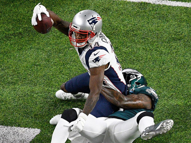 MINNEAPOLIS, MN - FEBRUARY 04: Malcolm Jenkins #27 of the Philadelphia Eagles tackles Brandin Cooks #14 of the New England Patriots during the first quarter in Super Bowl LII at U.S. Bank Stadium on February 4, 2018 in Minneapolis, Minnesota.