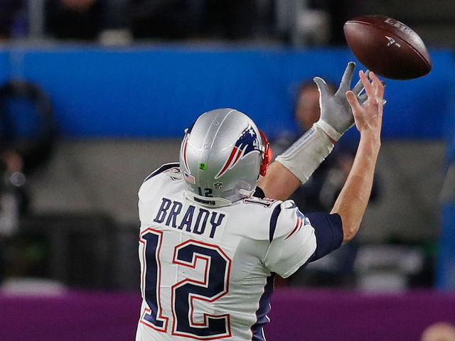 MINNEAPOLIS, MN - FEBRUARY 04: Tom Brady #12 of the New England Patriots drops a pass inteded for him from teammate Rob Gronkowski #87 (not pictured) during the second quarter against the Philadelphia Eagles in Super Bowl LII at U.S. Bank Stadium on February 4, 2018 in Minneapolis, Minnesota.