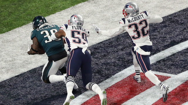MINNEAPOLIS, MN - FEBRUARY 04: Corey Clement #30 of the Philadelphia Eagles scores a 22-yard touchdown against Marquis Flowers #59 and Devin McCourty #32 of the New England Patriots in the third quarter of Super Bowl LII at U.S. Bank Stadium on February 4, 2018 in Minneapolis, Minnesota.