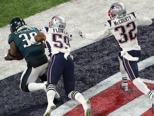 MINNEAPOLIS, MN - FEBRUARY 04: Corey Clement #30 of the Philadelphia Eagles scores a 22-yard touchdown against Marquis Flowers #59 and Devin McCourty #32 of the New England Patriots in the third quarter of Super Bowl LII at U.S. Bank Stadium on February 4, 2018 in Minneapolis, Minnesota.