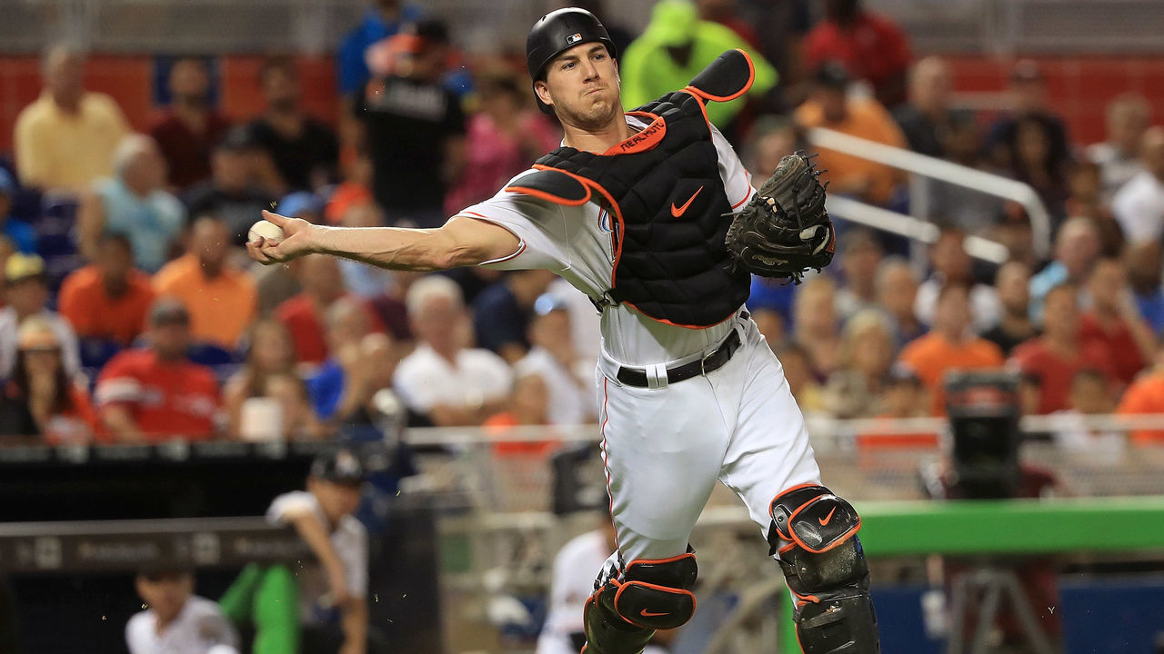 MIAMI, FL - JUNE 20: J.T. Realmuto #11 of the Miami Marlins makes a throw to first during a game against the Washington Nationals at Marlins Park on June 20, 2017 in Miami, Florida.