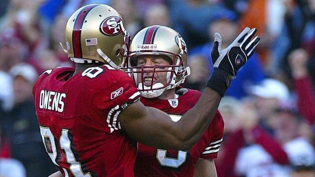 SAN FRANCISCO, UNITED STATES: San Francisco 49ers' quarterback Jeff Garcia (R) is greeted by teammate Terrell Owens after running in a touchdown against the New York Giants during the fourth quarter of the NFC Wildcard playoffs at Candlestick Park, 05 January 2003, in San Francisco, California. The 49ers won 39-38. AFP PHOTO/Monica M. DAVEY