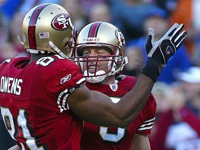 SAN FRANCISCO, UNITED STATES: San Francisco 49ers' quarterback Jeff Garcia (R) is greeted by teammate Terrell Owens after running in a touchdown against the New York Giants during the fourth quarter of the NFC Wildcard playoffs at Candlestick Park, 05 January 2003, in San Francisco, California. The 49ers won 39-38. AFP PHOTO/Monica M. DAVEY