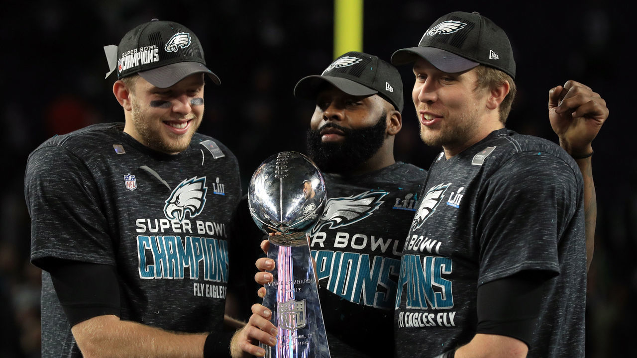 MINNEAPOLIS, MN - FEBRUARY 04: Malcolm Jenkins #27 of the Philadelphia Eagles (C) and Nick Foles #9 (R) of the Philadelphia Eagles hold the Lombardi Trophy after defeating the New England Patriots 41-33 in Super Bowl LII at U.S. Bank Stadium on February 4, 2018 in Minneapolis, Minnesota.