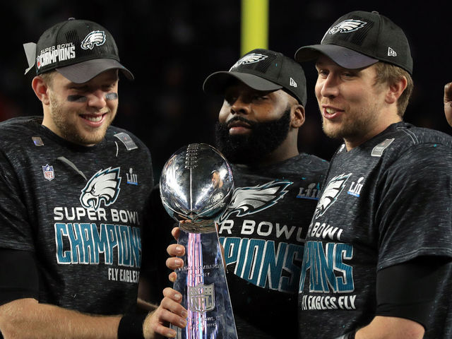 MINNEAPOLIS, MN - FEBRUARY 04: Malcolm Jenkins #27 of the Philadelphia Eagles (C) and Nick Foles #9 (R) of the Philadelphia Eagles hold the Lombardi Trophy after defeating the New England Patriots 41-33 in Super Bowl LII at U.S. Bank Stadium on February 4, 2018 in Minneapolis, Minnesota.