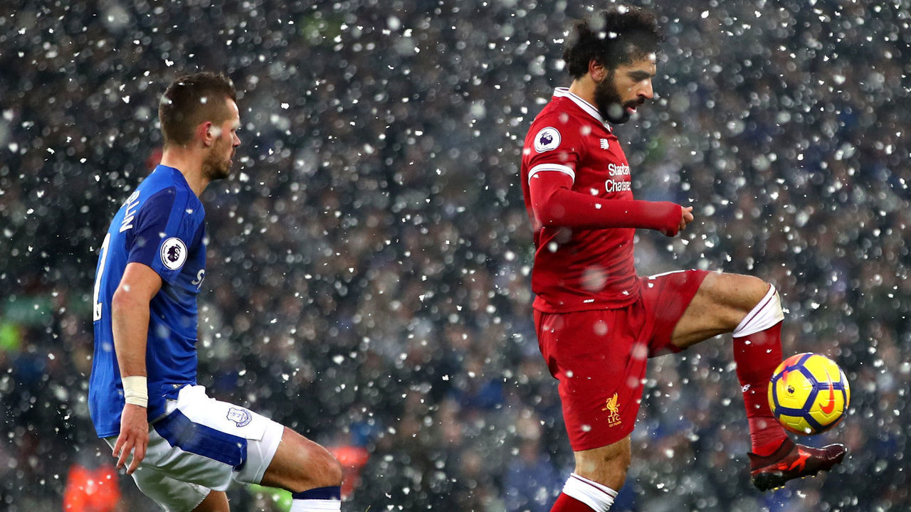 LIVERPOOL, ENGLAND - DECEMBER 10: Mohamed Salah of Liverpool and Morgan Schneiderlin of Everton in action during the Premier League match between Liverpool and Everton at Anfield on December 10, 2017 in Liverpool, England.
