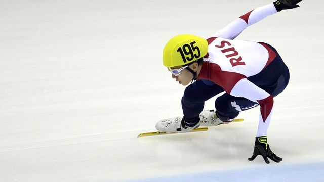 Victor An of Russia competes during the men's 1500m preliminaries of the ISU World Cup short track speed skating event in Dresden, eastern Germany, on February 6, 2015. AFP PHOTO / ROBERT MICHAEL