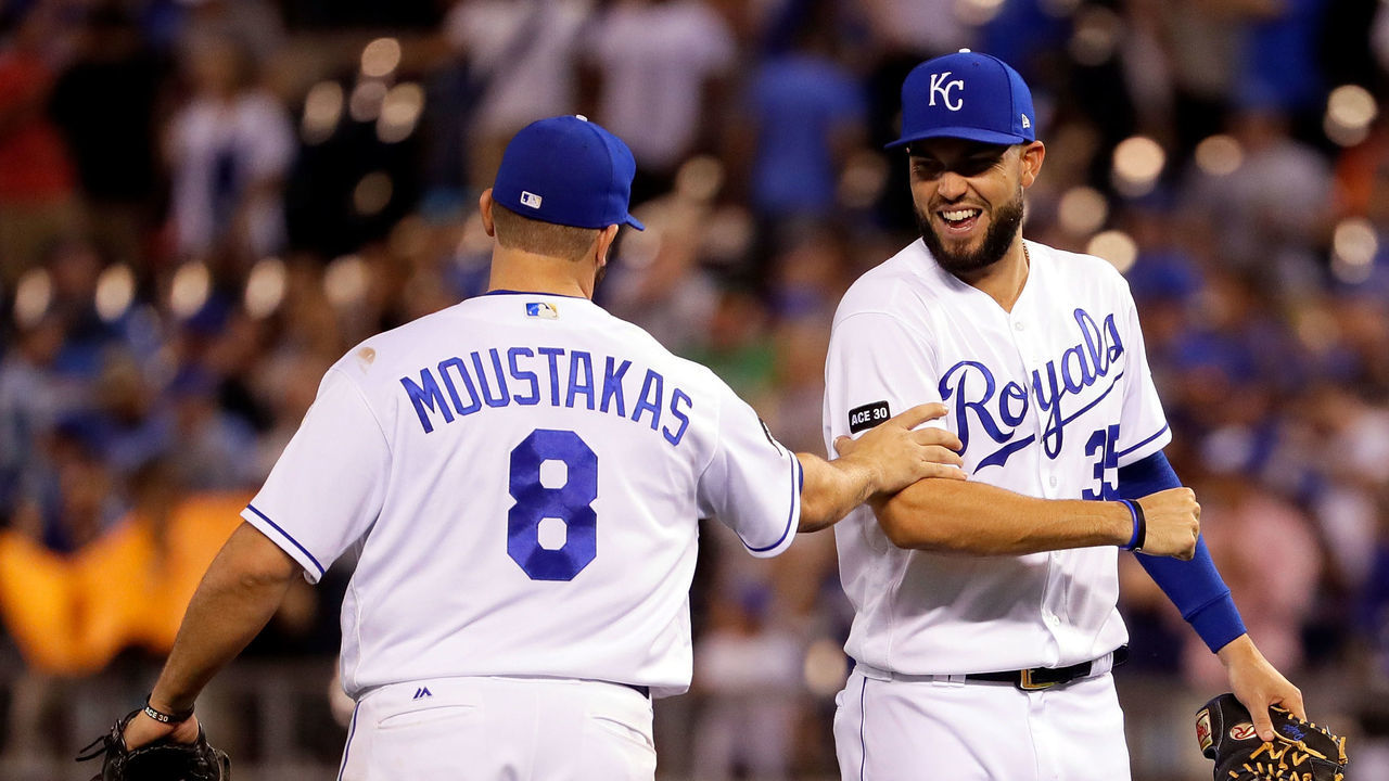 KANSAS CITY, MO - APRIL 19: Eric Hosmer #35 and Mike Moustakas #8 of the Kansas City Royals congratulate each other after the Royals defeated the San Francisco Giants 2-0 to win the game at Kauffman Stadium on April 19, 2017 in Kansas City, Missouri.